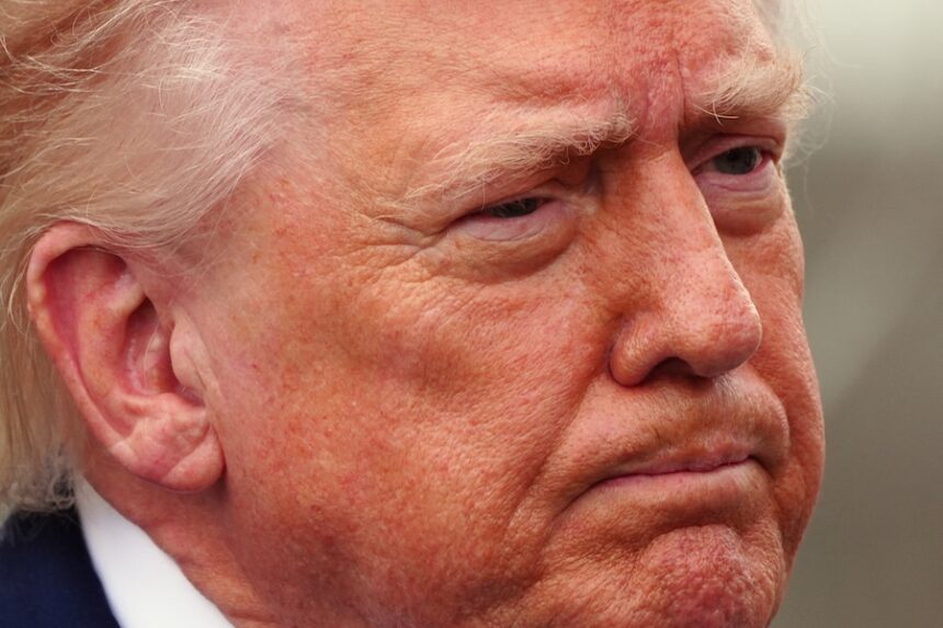 President Donald Trump speaks with reporters before departing on Marine One from the South Lawn of the White House, Friday, March 20, 2026, in Washington.