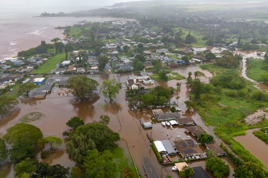 Streets are flooded from severe rains, Friday, March 20, 2026, in Haleiwa, Hawaii.