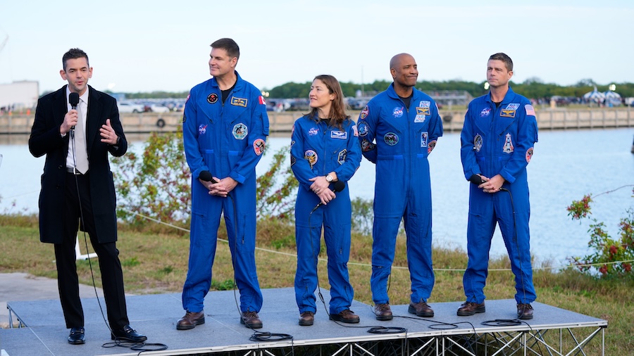 NASA administrator Jared Isaacman, left, answers questions during a news conference, next to the crew of the new moon rocket, Artemis II, from left, Canadian Space Agency astronaut Jeremy Hansen, mission specialist Christina Koch, pilot Victor Glover and commander Reid Wiseman at the Kennedy Space Center, Jan. 17, 2026, in Cape Canaveral, Fla.