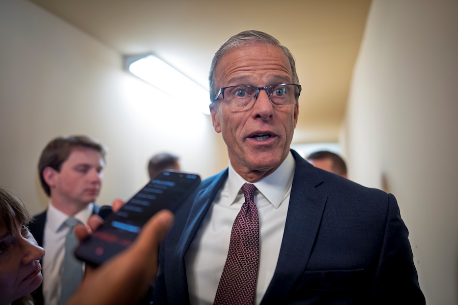 Senate Majority Leader John Thune, R-S.D., is met by reporters after a closed door meeting with fellow Republicans on the Homeland Security budget stalemate, at the Capitol in Washington, Thursday, March 26, 2026.