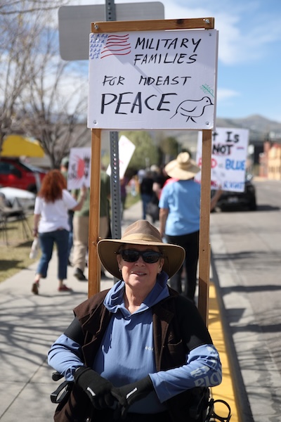EJ Zita carries a sign during a “No Kings” protest in Pocatello on Saturday, March 28, 2026.