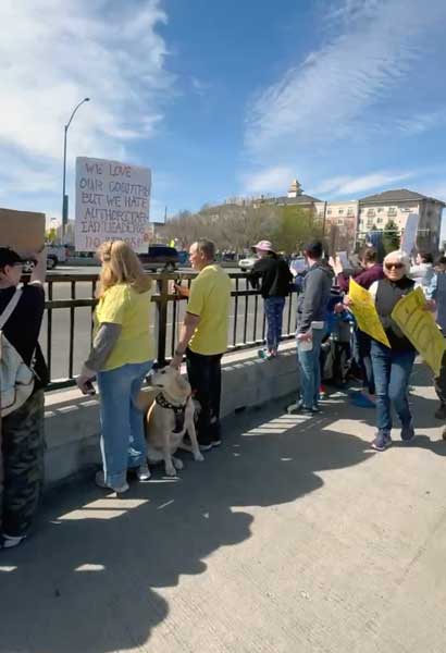 A crowd gathers on Broadway Bridge in Idaho Falls to participate in a "No Kings" rally on Saturday, March 28, 2026.