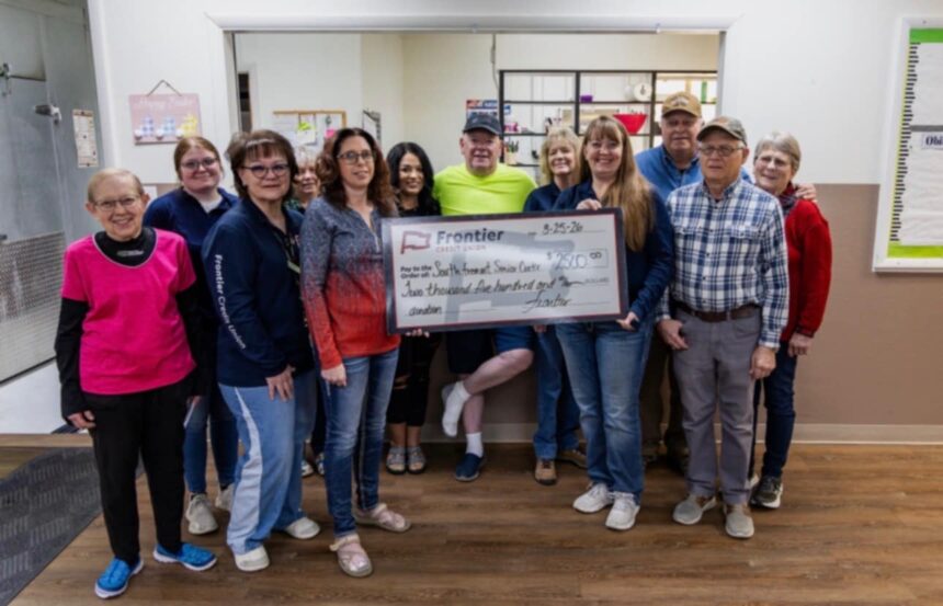 Director Kathy Sharp (left of check) receives a $2,500 donation from Frontier Credit Union, represented by St. Anthony branch manager Jarris Scollick. | Courtesy photo