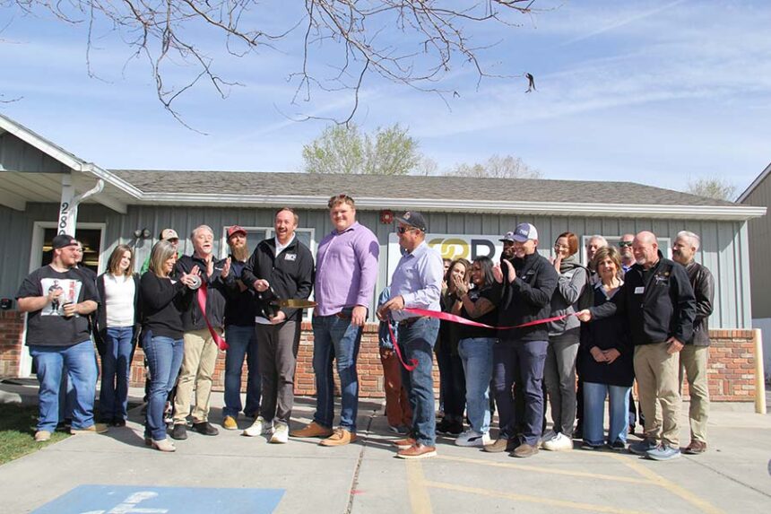 A ribbon-cutting is held in front of Good Help Operator School at 280 Laurel Lane in Chubback on Friday.