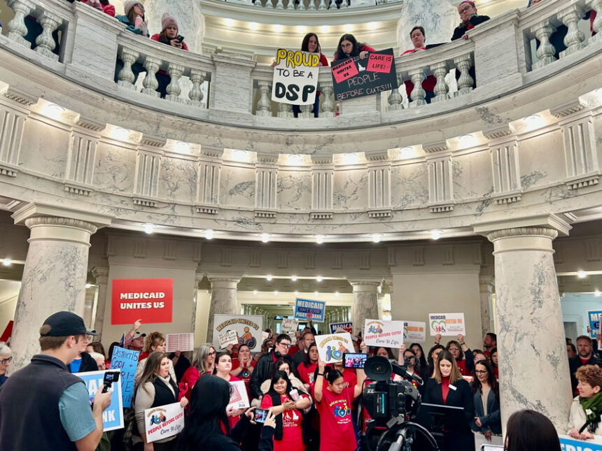 Hundreds of Idahoans gathered in the rotunda of the Idaho Capitol on Jan. 12, 2026, to protest proposed cuts to the state’s Medicaid program. The protest, organized by Idaho Voices for Children, took place before the governor’s State of the State Address. (Photo by Christina Lords/Idaho Capital Sun)