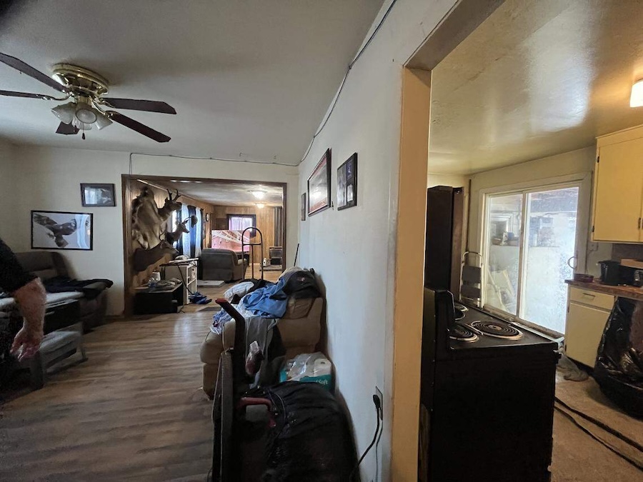A "before" photo shows the living room of a Boise home that won HomeVestors of America’s Ugliest House of the Year contest in 2025.