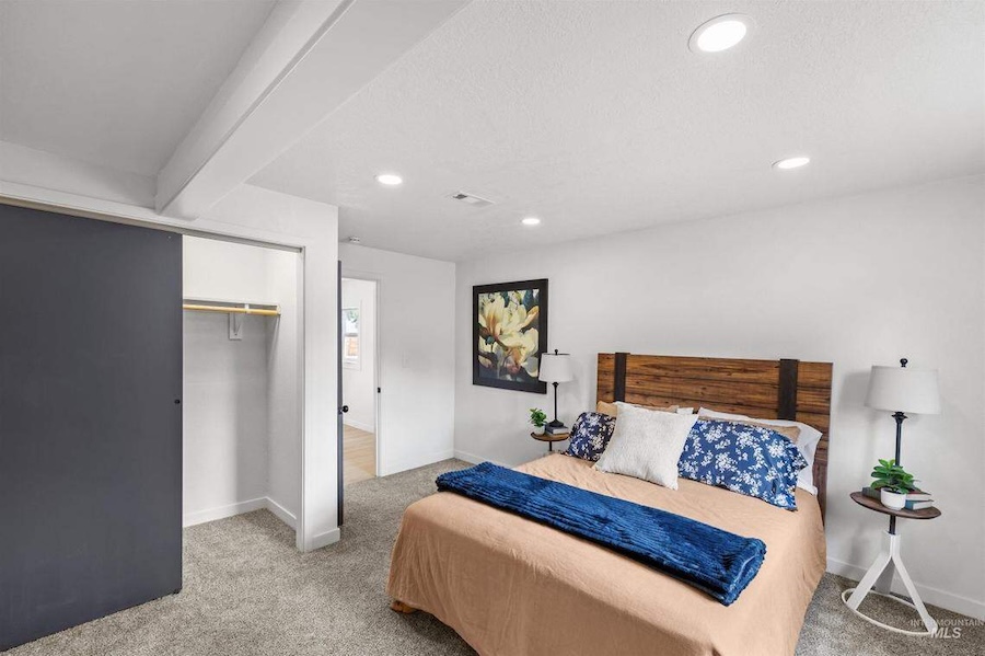 An "after" photo shows the bedroom of the Boise house that won HomeVestors of America’s Ugliest House of the Year contest in 2025 after undergoing renovations. | Courtesy HomeVestors