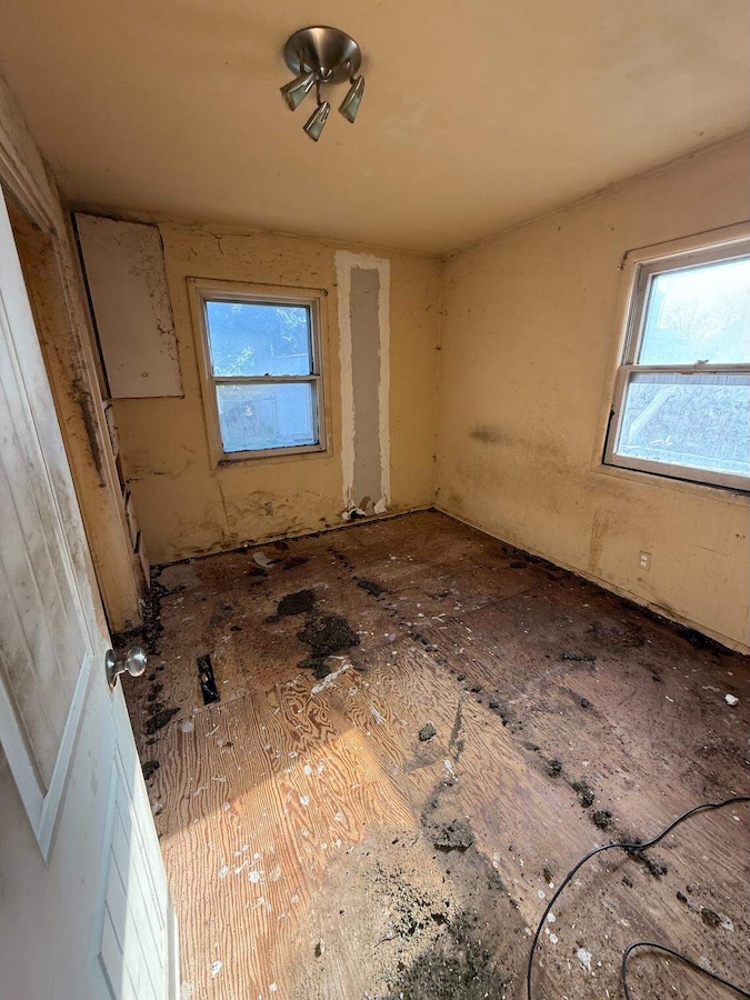 The bedroom of the Boise home was stripped before renovations. | Courtesy HomeVestors of America