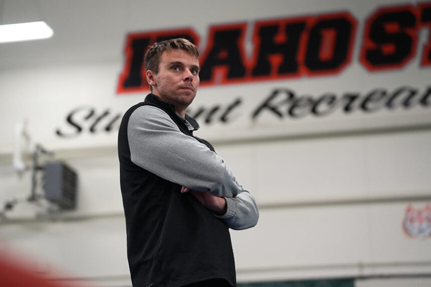 Idaho State men’s tennis head coach Oliver Good watches a recent home match from the sideline. | Photo courtesy ISU Athletics  