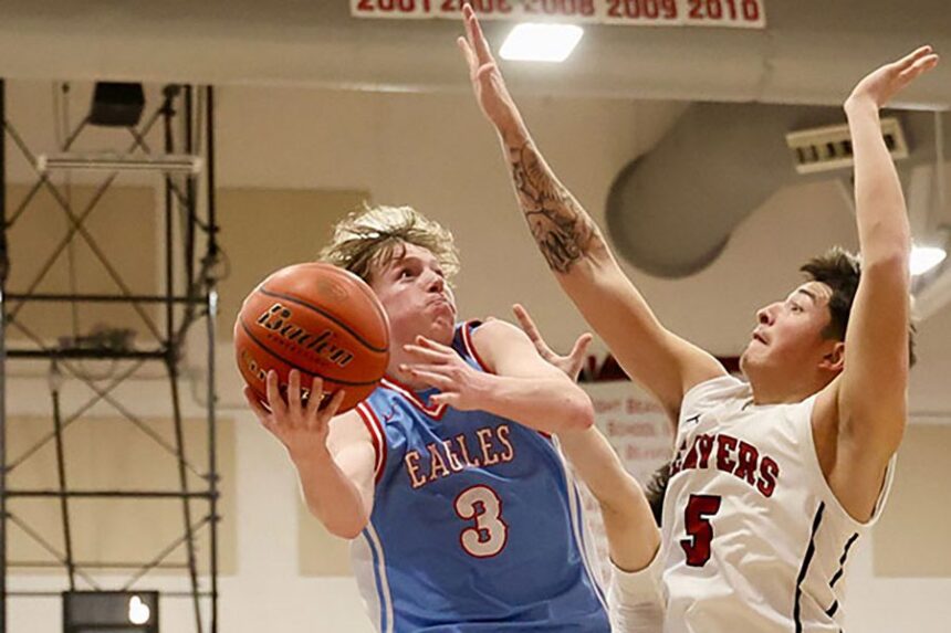 Marsh Valley High School senior Jaxson Smith scores inside against American Falls senior Kahlen Hernandez. Smith joins Teton’s Oliver Lifton and Luke Nelson as First-Team All-Tournament selections. | Kyle Riley, EastIdahoSports.com