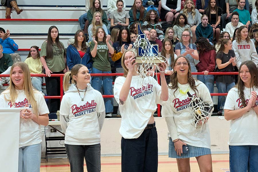 Abby Lusk and Oakley Hirschi hold the trophies from the back-to-back state championships during a ceremony at Pocatello High School