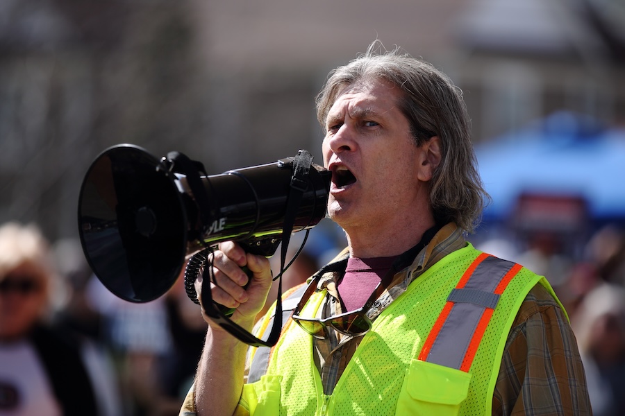Steve Neiner, an organizer of the Pocatello “No Kings” protest, speaks to the crowd gathered in Caldwell Park on Saturday, March 28, 2026.