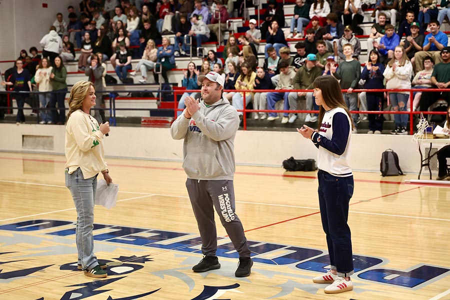 Pocatello wrestling coach JB Plato and girls' basketball coach Sunny Evans receive their district coach of the year awards