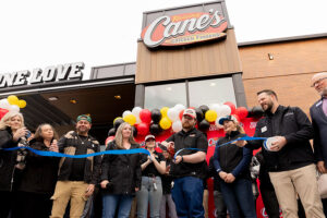 Officials with Raising Cane's and Chubbuck's Chamber of Commerce cutting the ribbon to open the city's newest Raising Cane's location. | Daniel V. Ramirez, EastIdahoNews.com