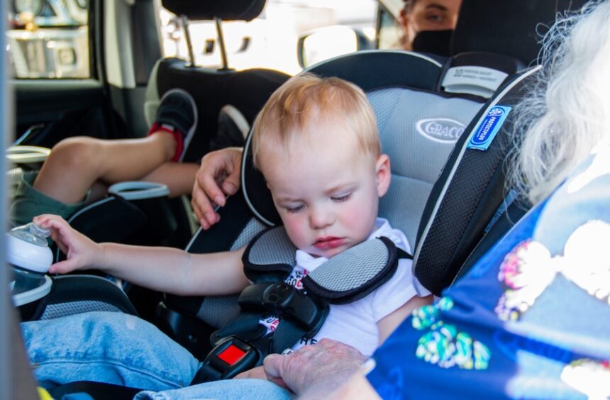 Susan Hinchcliffe, a volunteer with the Corrales Fire Department, gives Rachel Ralya’s 14-month old son a Moderna COVID-19 vaccine on June 23, 2022, following the FDA authorization of the vaccine for children ages 6 months to 5 years old.
