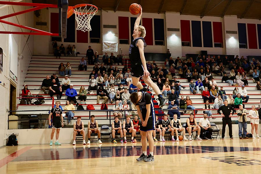 Preston Kasen Bryce dunks over Rockland's Woodrow Lowder during the D5 senior showcase dunk contest