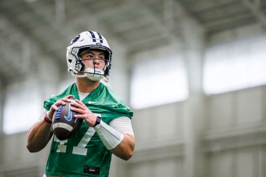 BYU quarterback Bear Bachmeier looks to pass during Monday’s practice at the indoor facility in Provo. | Aaron Cornia, BYU photo.