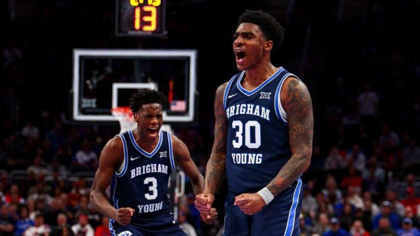 BYU guard Kennard Davis Jr. (30) and forward AJ Dybantsa (3) celebrate after a basket during the first half of the game against the Houston Cougars during the quarterfinal of the 2026 Phillips 66 Big 12 Men's Basketball Tournament at the T-Mobile Center in Kansas City, Missouri, on Thursday, March 12, 2026. (Photo: Rio Giancarlo, Deseret News)