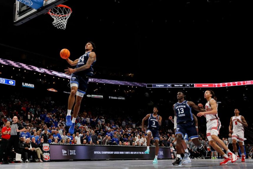 BYU forward Dominique Diomande (24) dunks during the first half of the game against the Houston Cougars during the quarterfinal of the 2026 Phillips 66 Big 12 Men's Basketball Tournament at the T-Mobile Center in Kansas City, Missouri, on Thursday, March 12, 2026. (Photo: Rio Giancarlo, Deseret News)