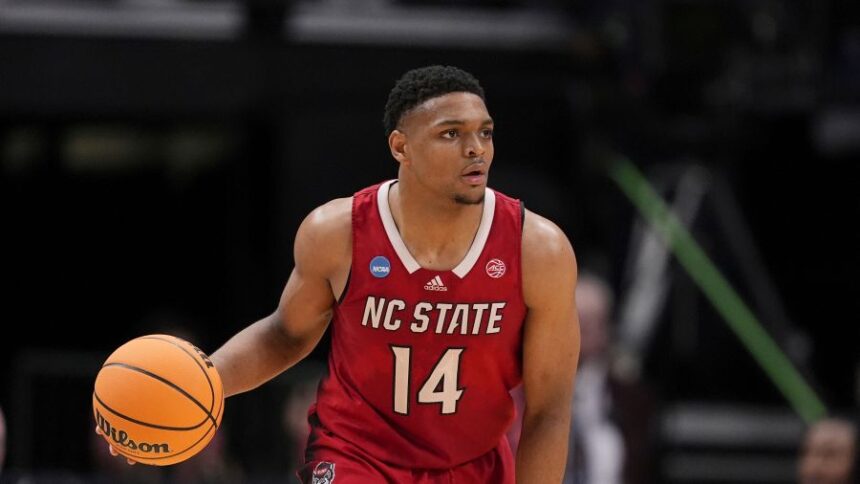 FILE - North Carolina State guard Casey Morsell dribbles the ball during a Sweet 16 college basketball game against Marquette in the NCAA Tournament in Dallas, March 29, 2024. (AP Photo/Tony Gutierrez, file)