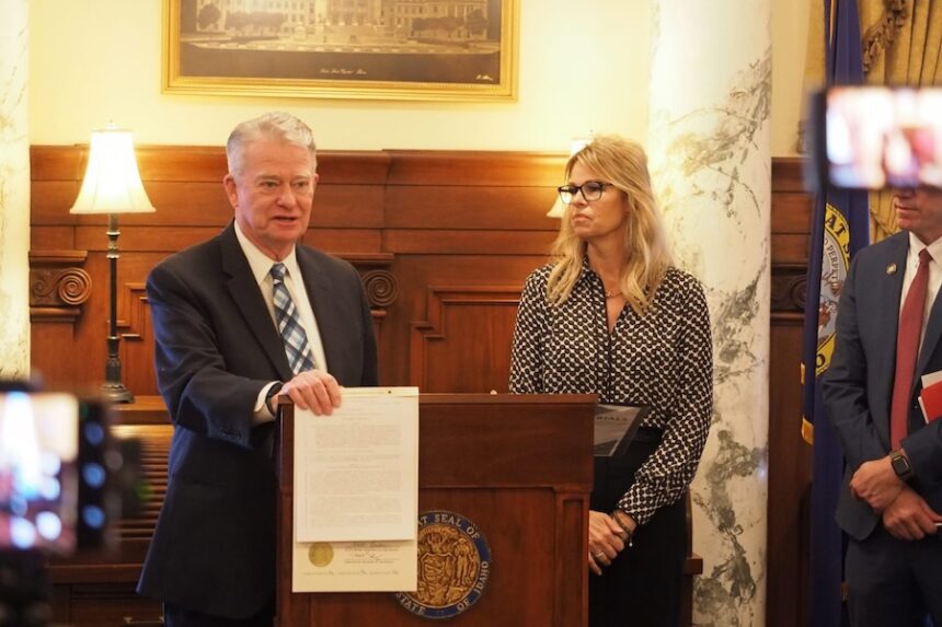 Idaho Gov. Brad Little, after signing an artificial intelligence education bill on Thursday, March 26, 2026, at the Idaho State Capitol in Boise. Idaho Superintendent of Public Instruction Debbie Critchfield stands at the governor's side.