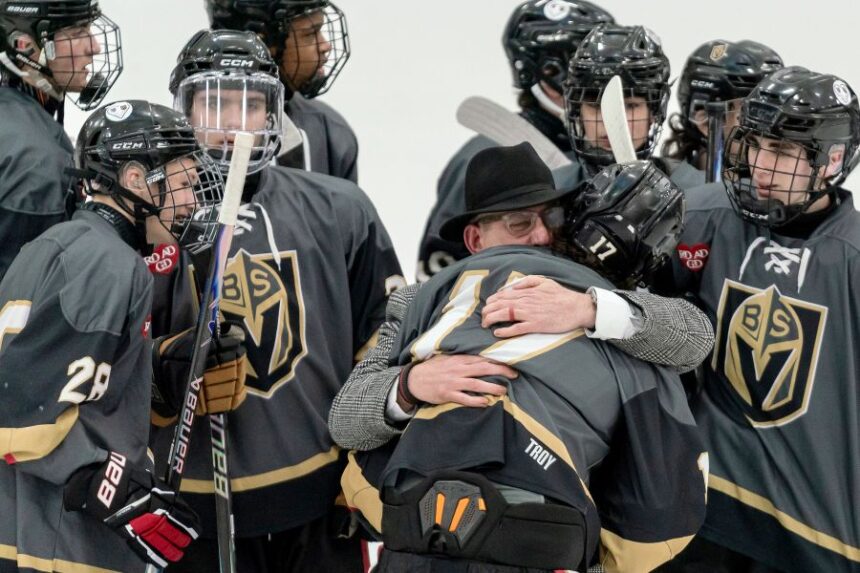 Blackstone Valley Schools head coach Chris Librizzi embraces Colin Dorgan after Dorgan scored the double-overtime game-winning goal against Portsmouth High School in the Rhode Island high school hockey state semifinal, Wednesday, March 11, 2026, at Schneider Arena on the campus of Providence College in Providence, R.I. (Courtesy of T.J. Auclair & Kyle Auclair/Little Big Leaguers Photography via AP)