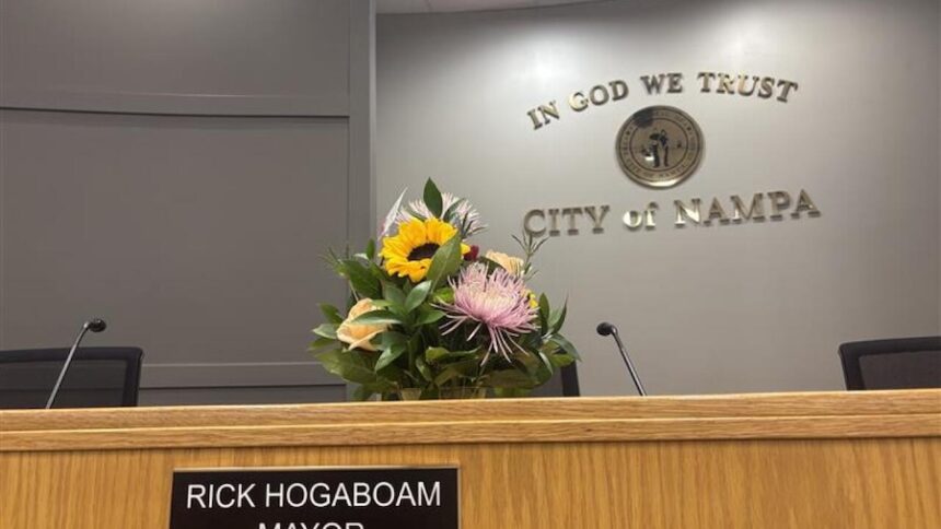 Flowers now sit inside Nampa City Hall, at Mayor Rick Hogaboam’s seat in City Council chambers, as city leaders begin navigating the loss of the mayor.