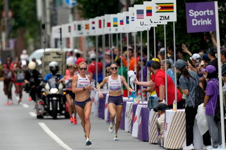 FILE - United States' Susanna Sullivan, left, and United States' Jessica McClain race in the women's marathon at the World Athletics Championships in Tokyo, Sept. 14, 2025. (AP Photo/Hiro Komae, File)