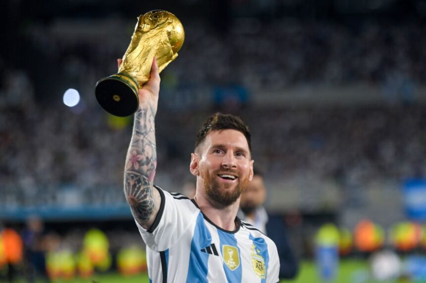 FILE - Argentina's Lionel Messi hoists the winning team replica of the FIFA World Cup trophy during a celebration ceremony for local fans after an international friendly soccer match against Panama at the Monumental stadium in Buenos Aires, Argentina, March 23, 2023. (AP Photo/Gustavo Garello, file)