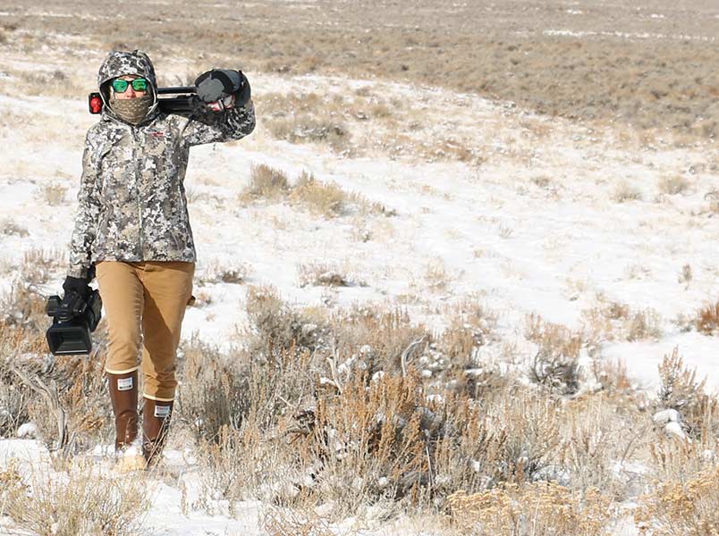 Kris Millgate hauling camera gear on a film shoot. | Courtesy Kris Millgate