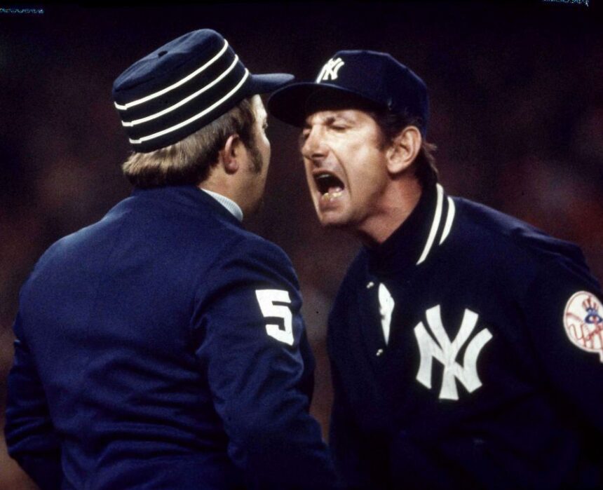 FILE - In this Oct. 21, 1976, file photo, New York Yankees manager Billy Martin argues a call with first base ump Bruce Froemming during the fourth game of baseball's World Series against the Cincinnati Reds at Yankee Stadium in New York. (AP Photo, File)