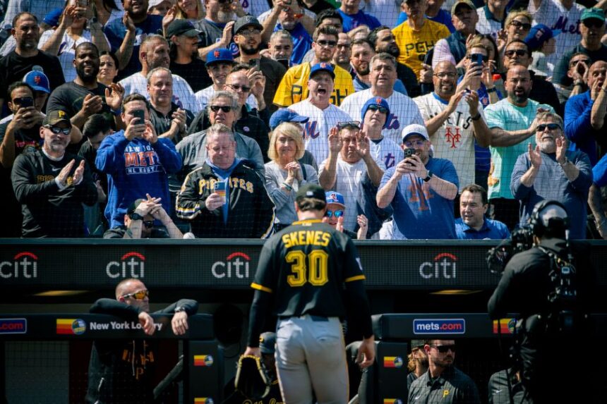 The crowd cheers and jeers as Pittsburgh Pirates pitcher Paul Skenes (30) exits the field after he was relieved in the first inning of an opening-day baseball game against the New York Mets, Thursday, March 26, 2026, in New York. (AP Photo/Angelina Katsanis)