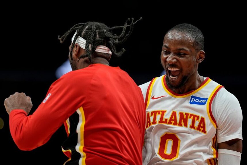Atlanta Hawks forward Jonathan Kuminga (0) celebrates his basket against the Portland Trail Blazers during the second half of an NBA basketball game, Sunday, March 1, 2026, in Atlanta. (AP Photo/Mike Stewart)