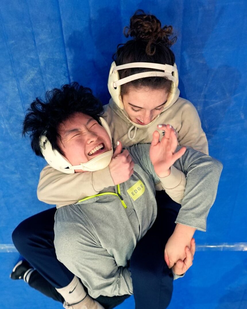 FILE - North Central women's wrestling team's Amani Jones, right, works with Yele Aycock during a practice at the Alliant Energy Powerhouse arena in Cedar Rapids, Iowa, Wednesday, March 6, 2024. (AP Photo/Nam Y. Huh, File)