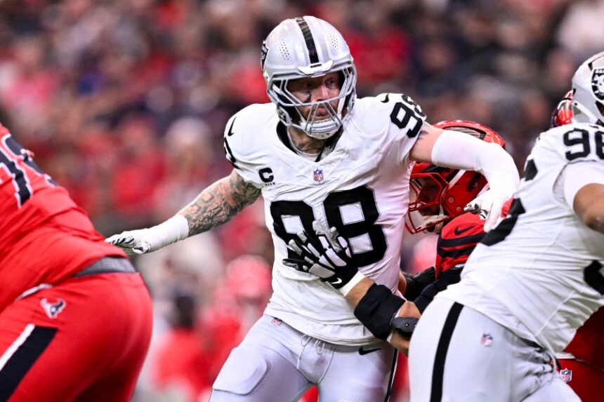 FILE - Las Vegas Raiders defensive end Maxx Crosby (98) rushes during the first half of an NFL football game against the Houston Texans, Dec. 21, 2025, in Houston. (AP Photo/Maria Lysaker, File)