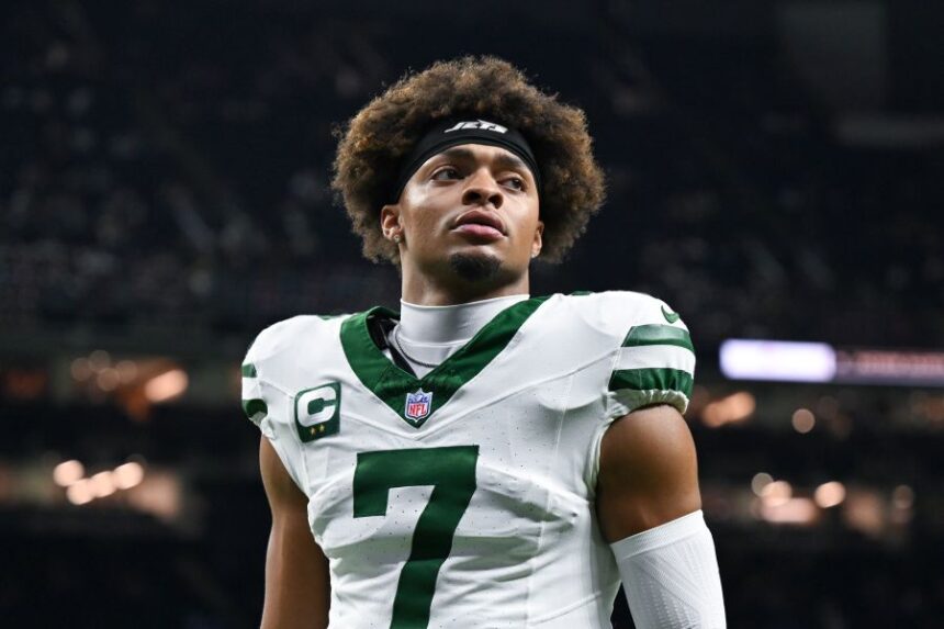 FILE - New York Jets quarterback Justin Fields warms up before an NFL football game against the New Orleans Saints on Dec. 21, 2025, in New Orleans. (AP Photo/Ella Hall, File)