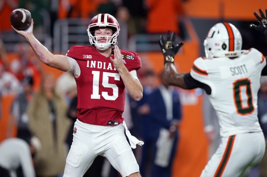 FILE - Indiana quarterback Fernando Mendoza passes against Miami during the first half of the College Football Playoff national championship game, Jan. 19, 2026, in Miami Gardens, Fla. (AP Photo/Rebecca Blackwell, File)