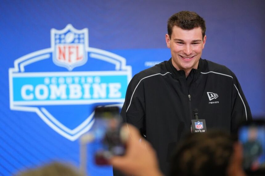 FILE - Indiana quarterback Fernando Mendoza (11) speaks during a news conference at the NFL football scouting combine in Indianapolis, Feb. 27, 2026. (AP Photo/Julio Cortez, File)