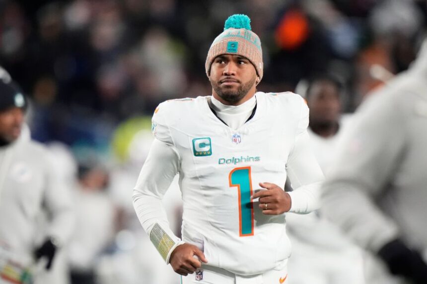 FILE - Miami Dolphins quarterback Tua Tagovailoa runs off the field during the first half of an NFL football game against the New England Patriots in Foxborough, Mass., Jan. 4, 2026. (AP Photo/Robert F. Bukaty, file)