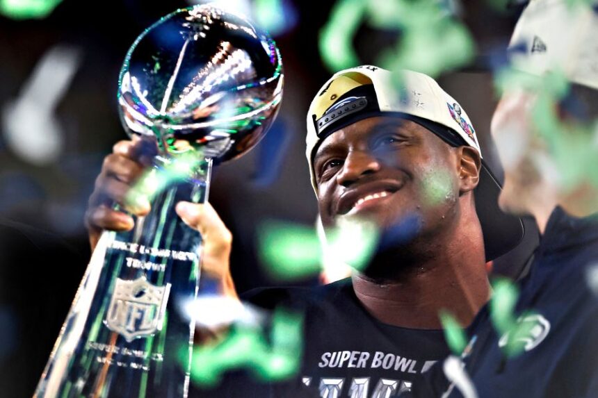 Seattle Seahawks running back Kenneth Walker III holds the Lombardi trophy after the Seahawks defeated the New England Patriots in the Super Bowl 60 in Santa Clara, Calif., Sunday, Feb. 8, 2026. (Scott Strazzante/San Francisco Chronicle via AP)