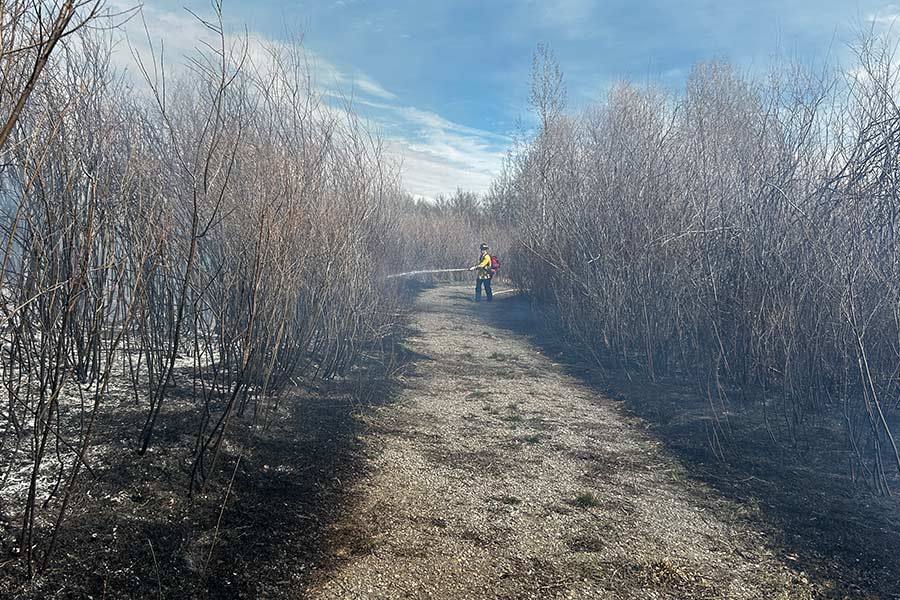 Firefighter on scene of the river bottom fire in Madison County on March 25. | Courtesy Troyce Miskin