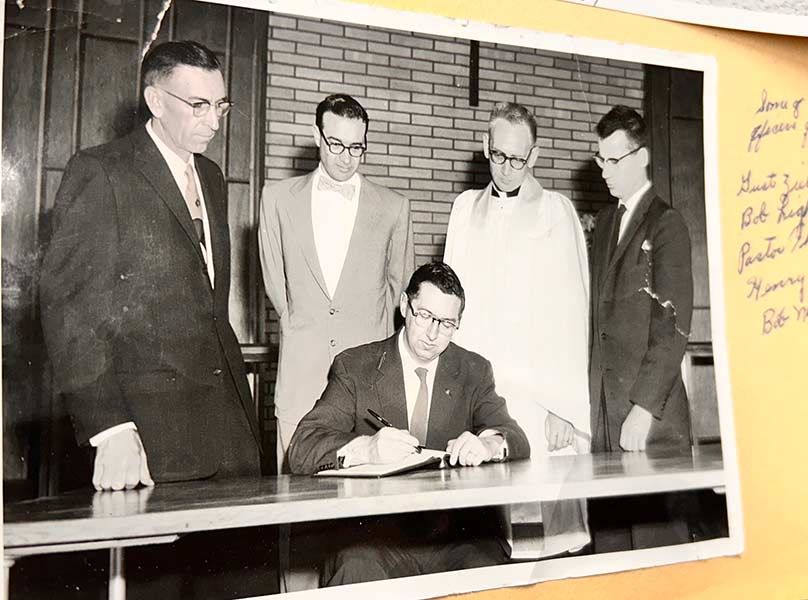 Pastor Robert Thoelke, second from left, with several other men. | Photo from church records