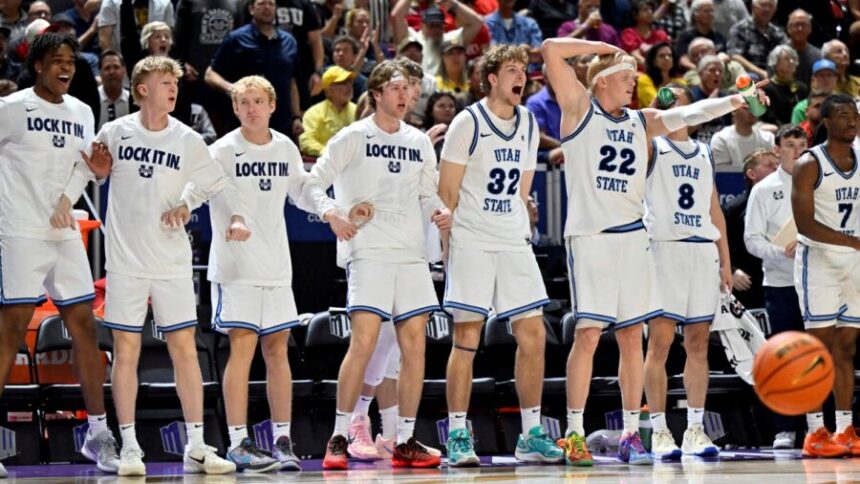 LAS VEGAS, NEVADA - MARCH 14: The Utah State Aggies bench reacts after a basket against the San Diego State Aztecs during the second half of the championship game of the Mountain West Conference men’s basketball tournament at the Thomas & Mack Center on March 14, 2026 in Las Vegas, Nevada. The Aggies defeated the Aztecs 73-62. (Photo by David Becker/Getty Images)