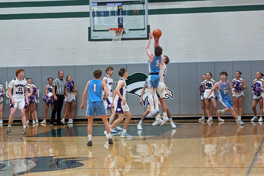 Marsh Valley Tate Whitworth shoots over Snake River Graham High