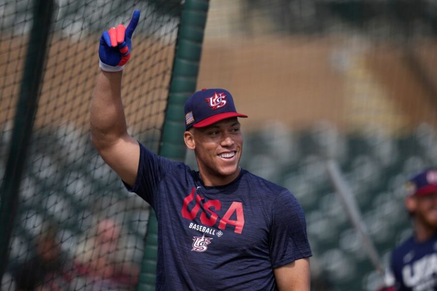United States' Aaron Judge smiles while taking batting practice prior to an exhibition baseball game against the Colorado Rockies Wednesday, March 4, 2026, in Scottsdale, Ariz. (AP Photo/Ross D. Franklin)