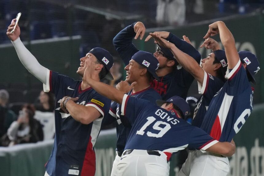 South Korea players celebrate after defeating Australia in their World Baseball Classic game on Monday, March 9, 2026 in Tokyo. (AP Photo/Eugene Hoshiko)