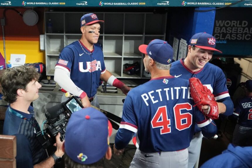 The United States team celebrates after defeating the Dominican Republic at a World Baseball Classic semifinal game, Sunday, March 15, 2026, in Miami. (AP Photo/Lynne Sladky)