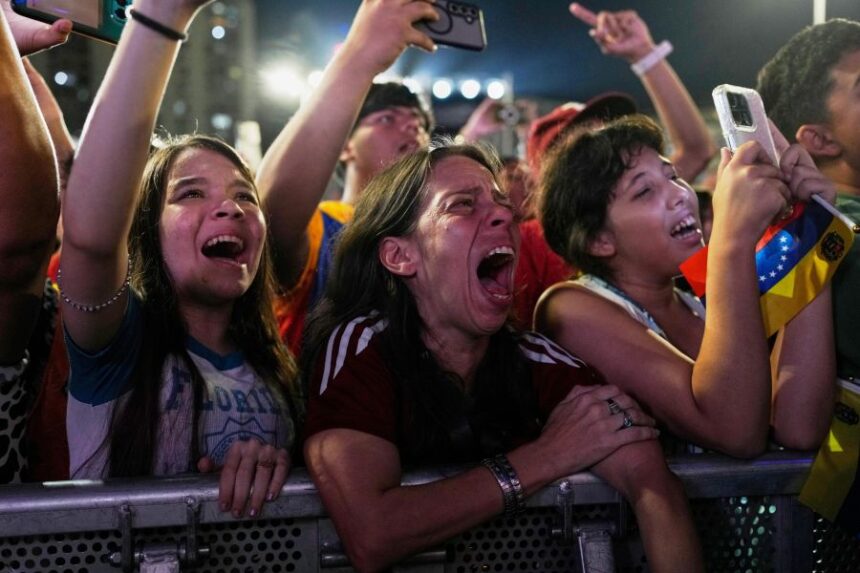 Venezuela fans celebrate their country's win against the United States in the championship match of the World Baseball Classic a day prior, in Caracas, Venezuela, Wednesday, March 18, 2026. (AP Photo/Ariana Cubillos)
