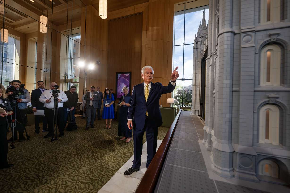 President Dieter F. Uchtdorf, acting president of the Quorum of the Twelve Apostles, talks about the Salt Lake Temple after he and President Emily Belle Freeman, Young Women general president for The Church of Jesus Christ of Latter-day Saints, lead media members on a tour of the new visitors' center on Temple Square in Salt Lake City on Monday. | Scott G Winterton, Deseret News