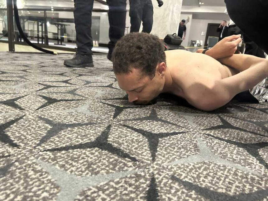 Cole Tomas Allen, 31, of Torrance, Calif., is held down by Secret Service agents after police say he fired a shotgun while attempting to gain access to the ballroom where President Donald Trump was attending a dinner inside Washington Hilton on Saturday, April 25, 2026. Trump was attending the annual White House Correspondents' Association dinner at the time and was quickly evacuated.